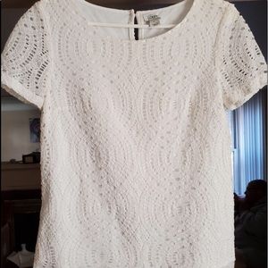 White lace top with scalloped trim.